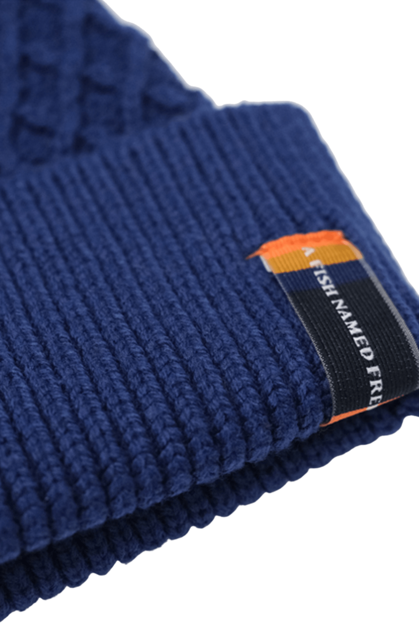Blue knit men's beanie with a brand tag on a white background