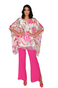 Model wearing Allison 2977 Fuchsia White Top with flowing pink and white floral print by Allison, shop Allison at Dotique.