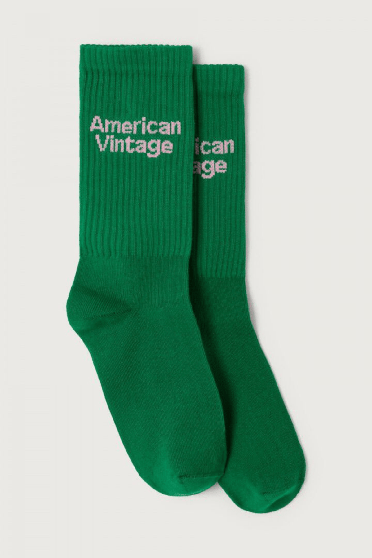 Green socks with 'American Vintage' text on a light gray background