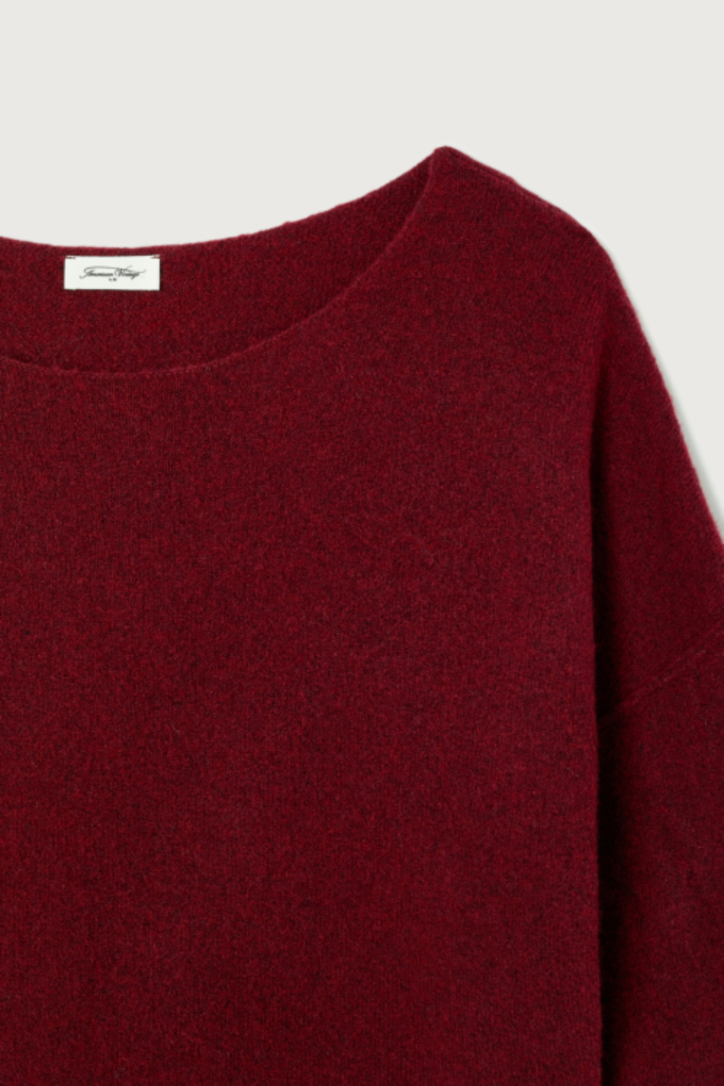 Shop the American Vintage Damsville Jumper in Cerisier Chine at Dotique. A luxuriously soft wool blend knit with a relaxed fit, boat neckline and rich cherry red melange colour.