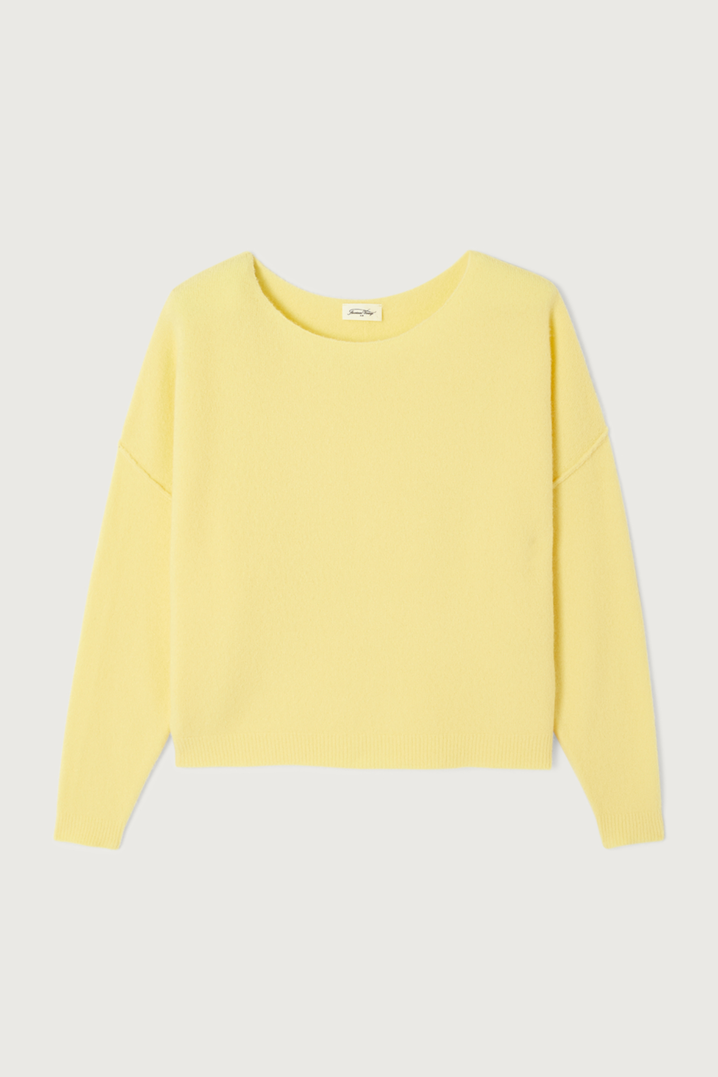 Shop the American Vintage Damsville Jumper in Beurre Chine at Dotique. A luxuriously soft wool blend knit with a relaxed fit in a fresh buttery yellow melange.