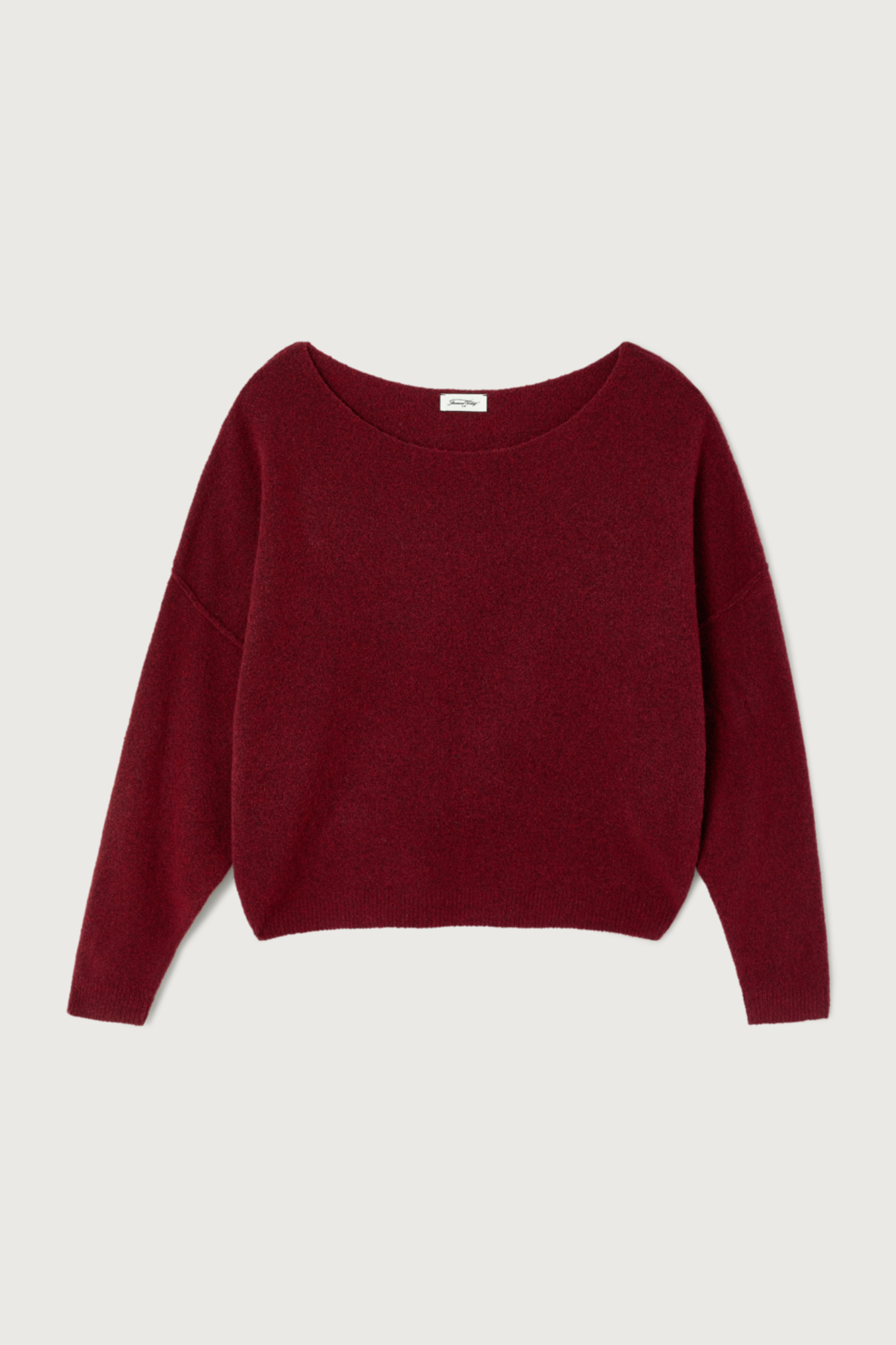 Shop the American Vintage Damsville Jumper in Cerisier Chine at Dotique. A luxuriously soft wool blend knit with a relaxed fit, boat neckline and rich cherry red melange colour.