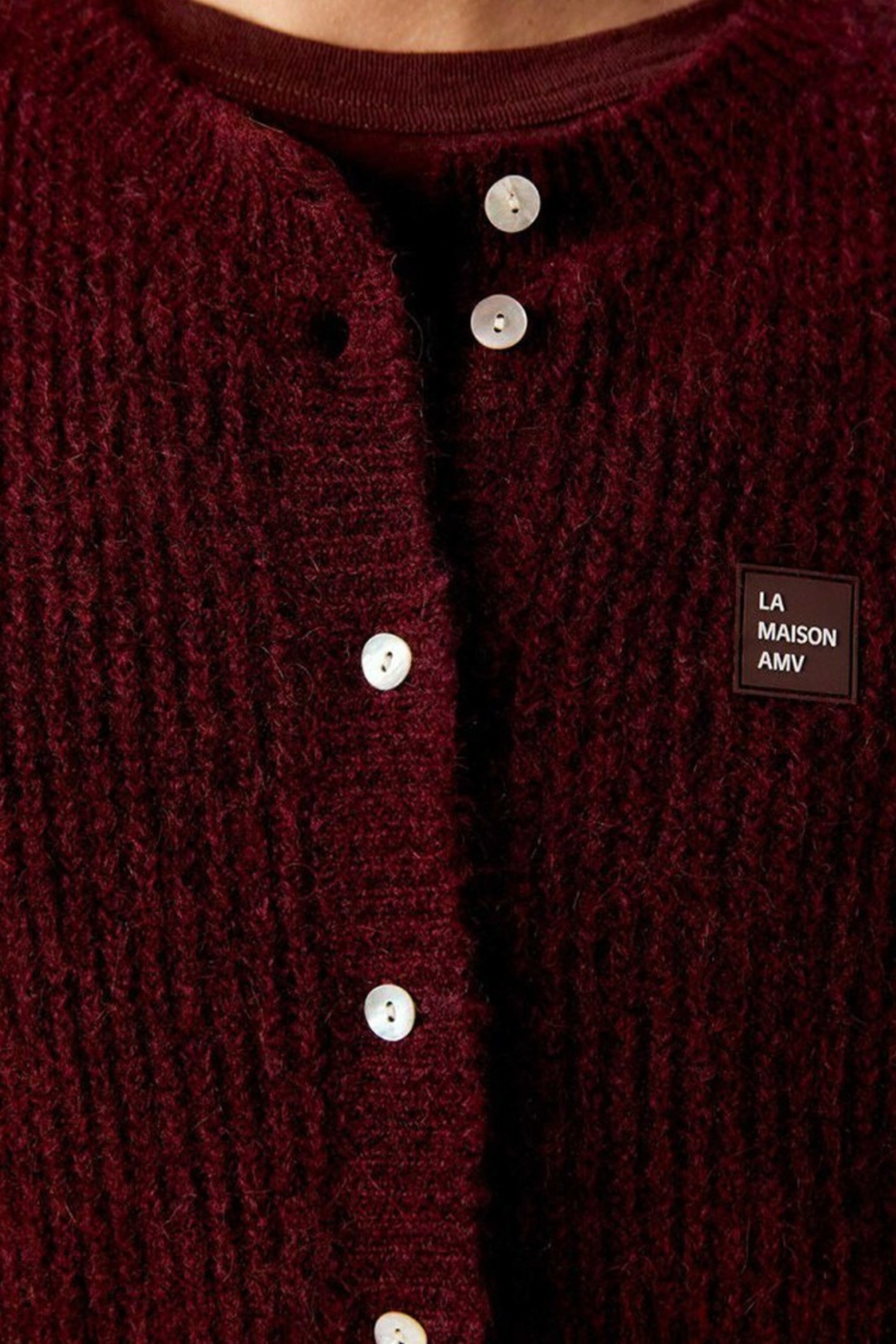 Shop the American Vintage East Knitted Waistcoat in Acerola Chine at Dotique. A soft alpaca blend knitted waistcoat with a relaxed fit, button front and rich burgundy melange colour.