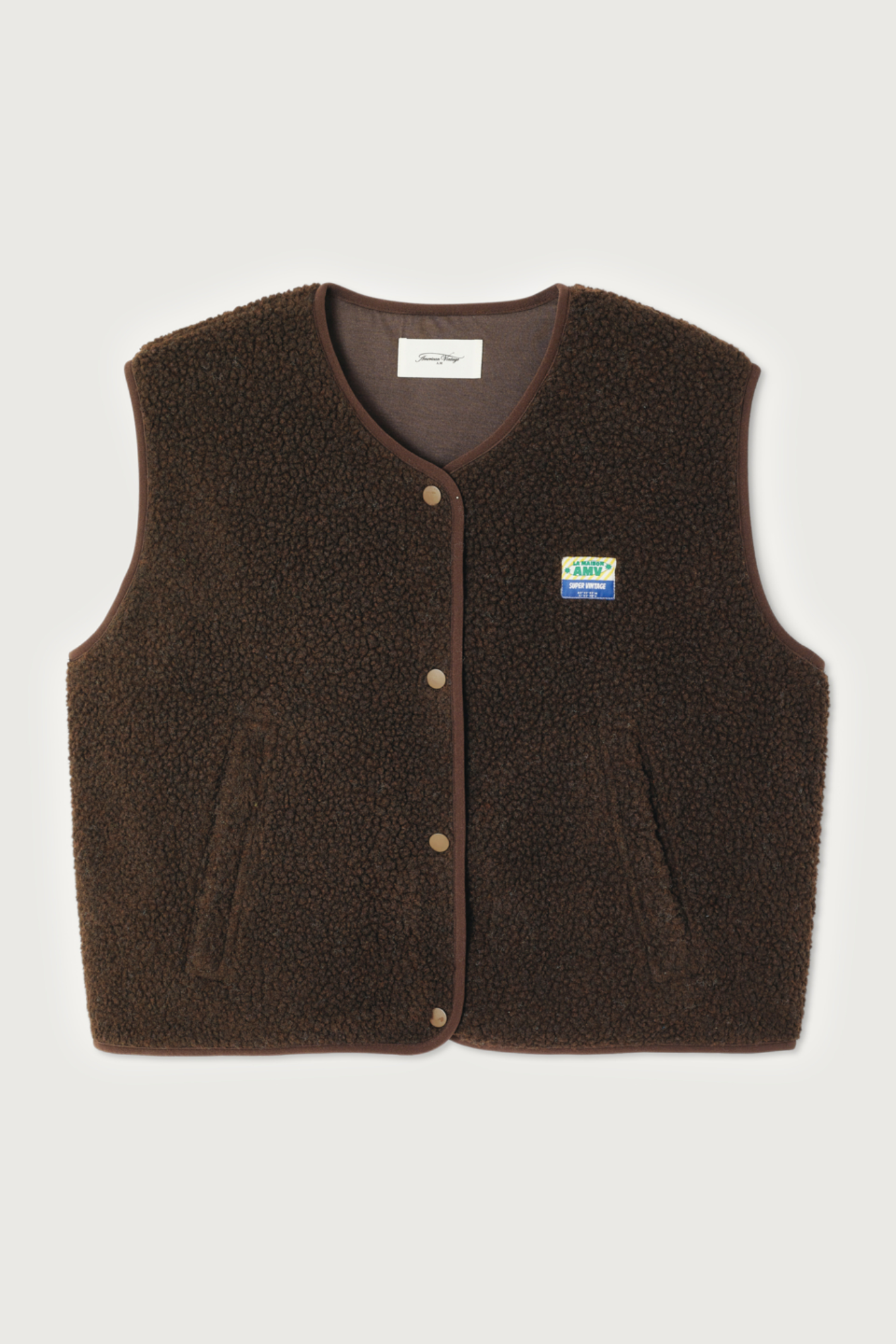 Shop the American Vintage Hoktown Sleeveless Fleece Gilet in Marronnier Chine at Dotique. A cosy recycled fleece layering piece with a relaxed fit and soft shearling texture.