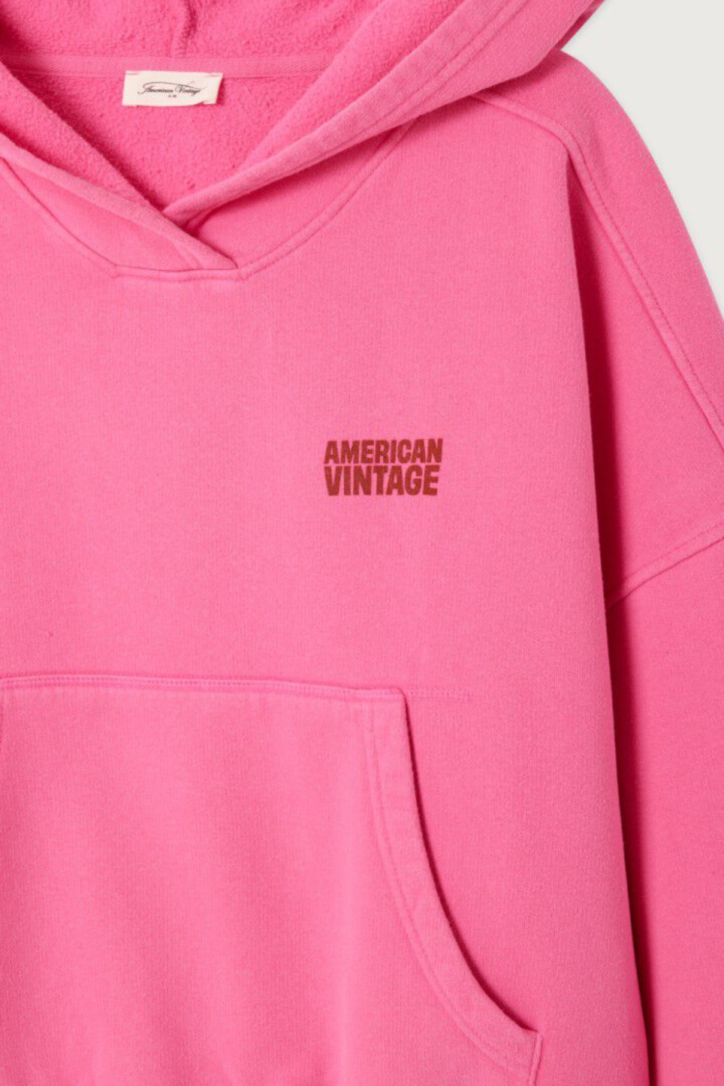 Close-up of pink American Vintage Plizzy Cotton Hoodie – Petunia Vintage with logo, shop American Vintage at Dotique