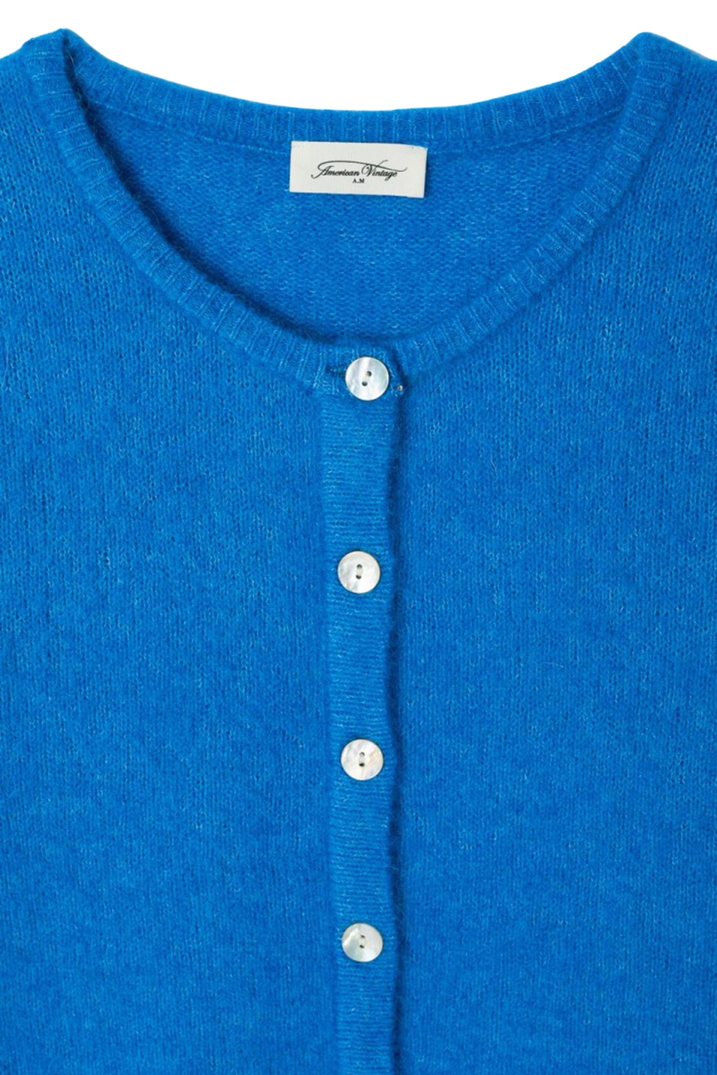 Shop the American Vintage Vitow Cardigan in Curacao Chine at Dotique. A luxuriously soft alpaca and wool blend cardigan with a relaxed fit and vibrant blue colour.