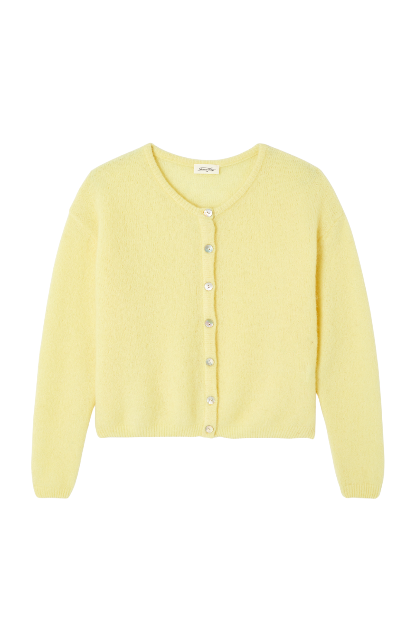 Shop the American Vintage Vitow Cardigan in Citronnier Chine at Dotique. A luxuriously soft alpaca and wool blend cardigan in a fresh yellow hue with a relaxed fit.