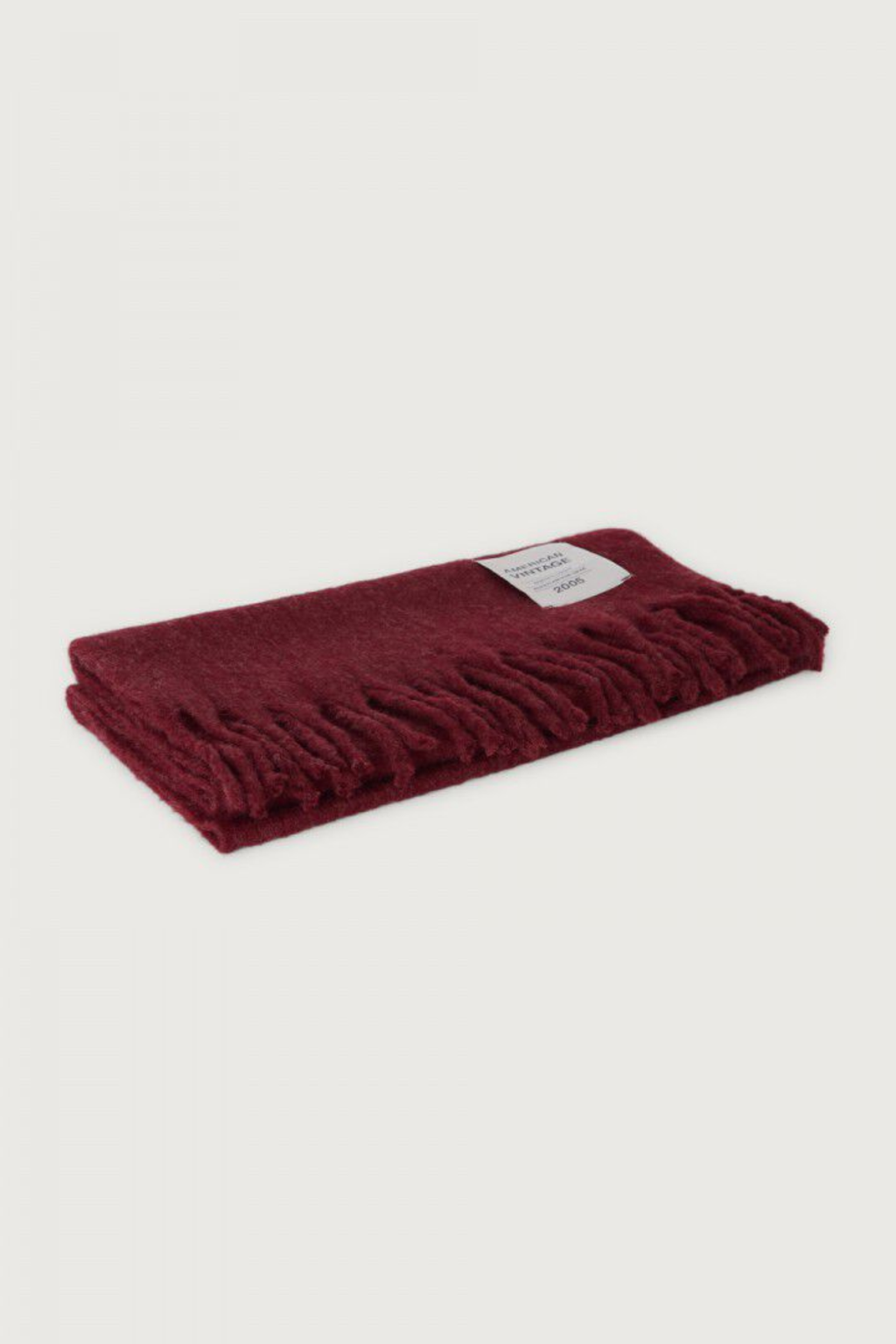 Shop the American Vintage Zinaco Scarf in Cherry Tree Logo at Dotique. A soft brushed scarf with fringed edges in a rich burgundy shade for effortless everyday styling.
