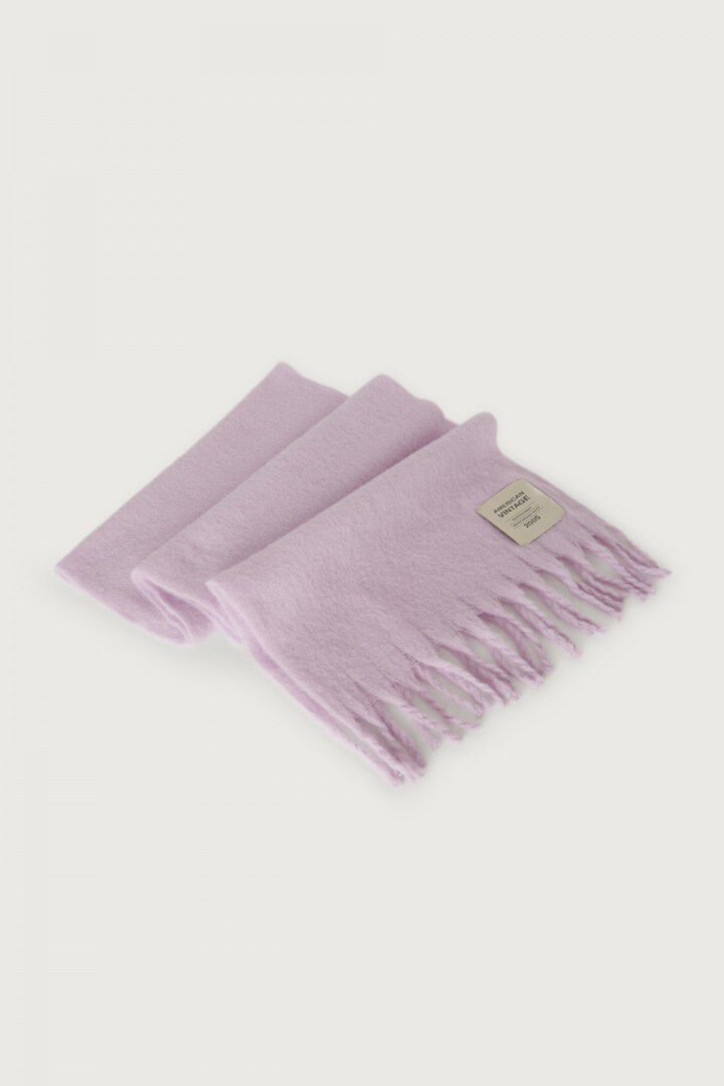 Shop the American Vintage Zinaco Scarf in Lilac at Dotique. A soft brushed scarf with fringed edges in a beautiful pastel lilac shade for effortless everyday styling.