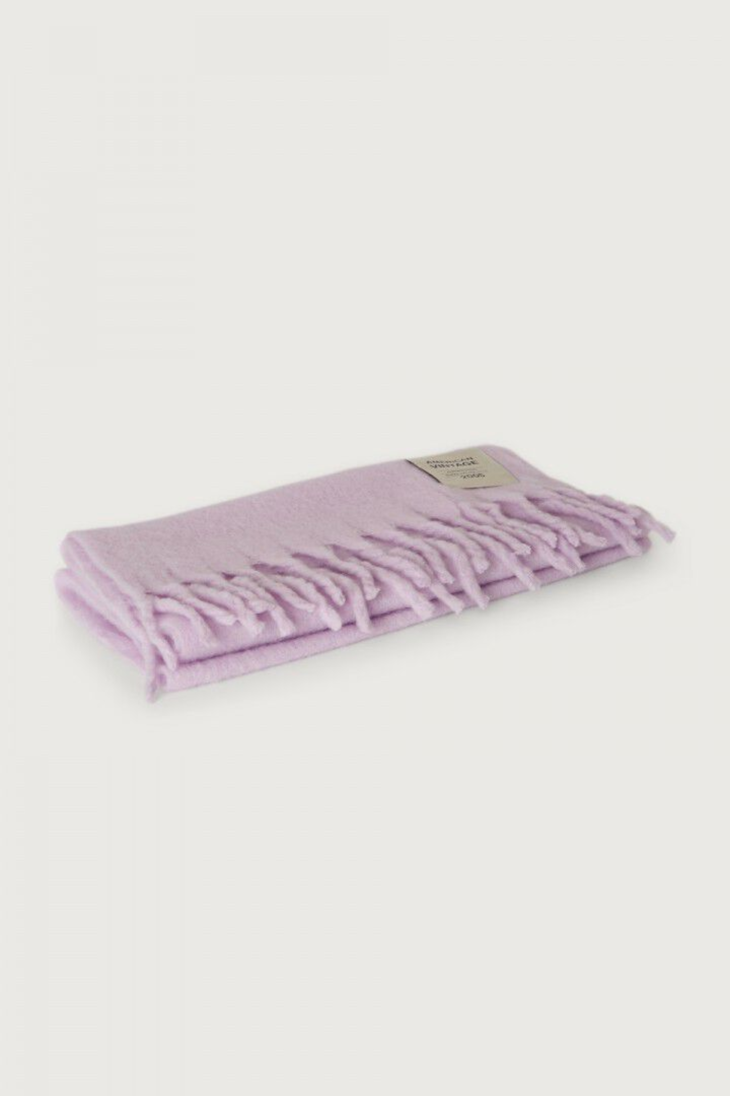 Shop the American Vintage Zinaco Scarf in Lilac at Dotique. A soft brushed scarf with fringed edges in a beautiful pastel lilac shade for effortless everyday styling.