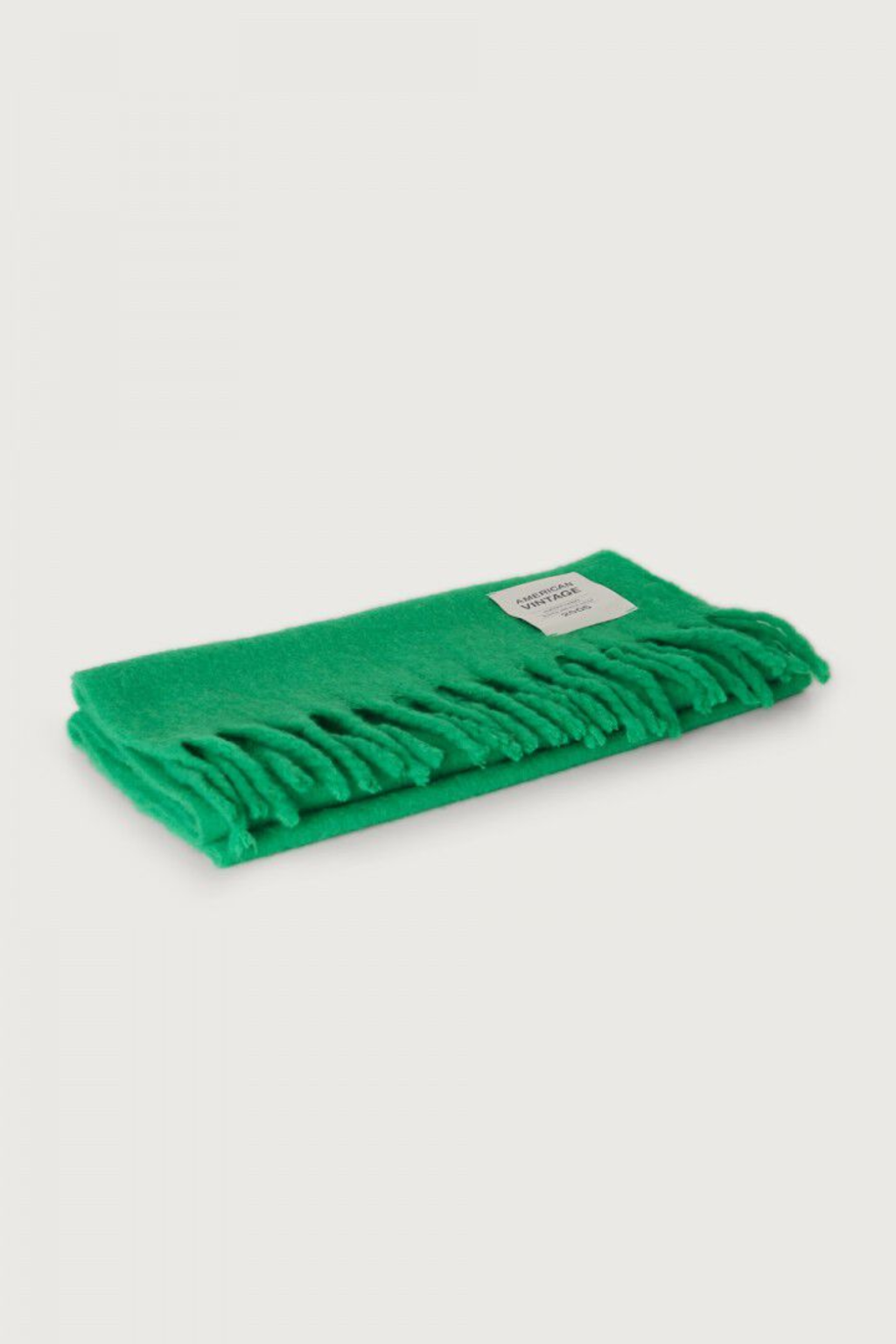 Shop the American Vintage Zinaco Scarf in Mint at Dotique. A soft brushed scarf with fringed edges in a vibrant green shade for effortless everyday styling.