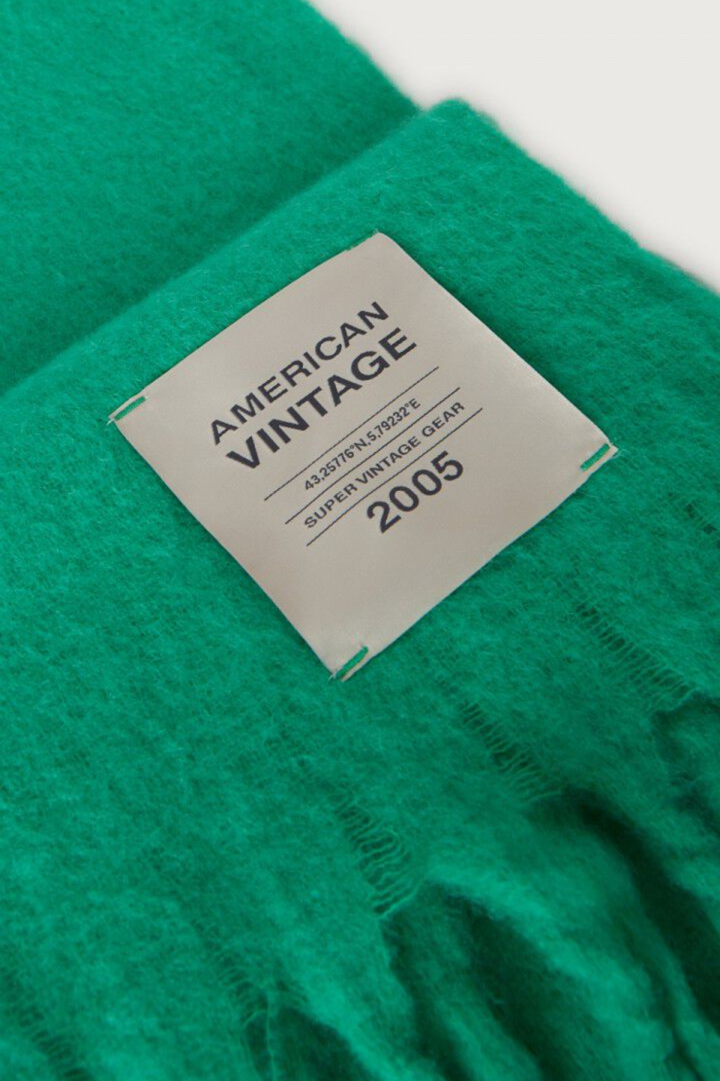 Shop the American Vintage Zinaco Scarf in Mint at Dotique. A soft brushed scarf with fringed edges in a vibrant green shade for effortless everyday styling.