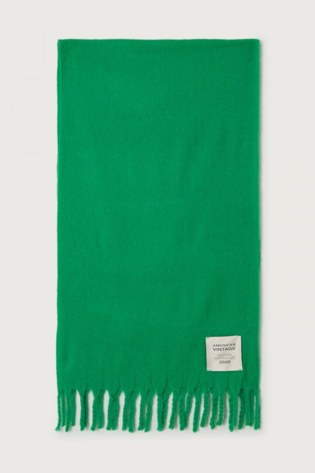 Shop the American Vintage Zinaco Scarf in Mint at Dotique. A soft brushed scarf with fringed edges in a vibrant green shade for effortless everyday styling.