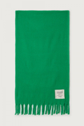 Shop the American Vintage Zinaco Scarf in Mint at Dotique. A soft brushed scarf with fringed edges in a vibrant green shade for effortless everyday styling.