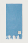 Shop the American Vintage Zinaco Scarf in Siberie at Dotique. A soft brushed scarf with fringed edges in a vibrant blue shade for effortless everyday styling.