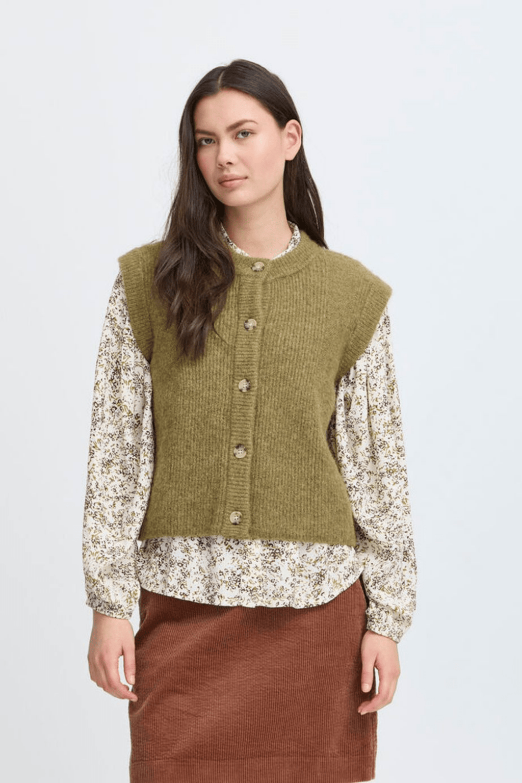 Atelier Rêve Irsilvi Waistcoat, crafted in a cosy moss melange green knit. Available at Dotique Witney