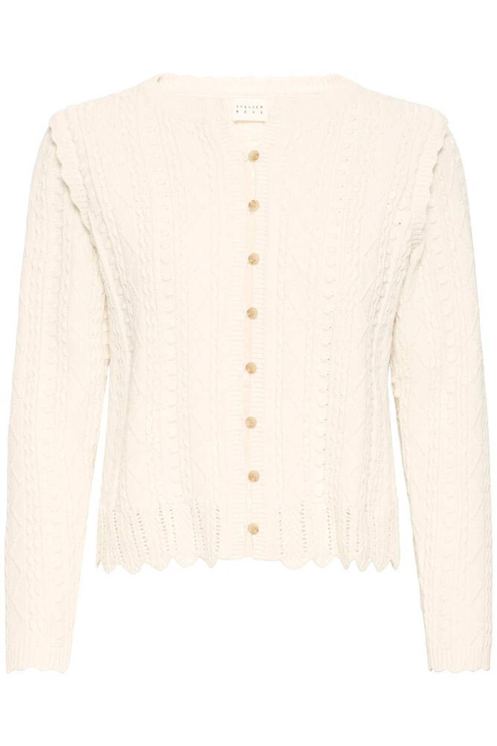 Soft cotton cardigan by Atelier Rêve in a classic birch shade. Easy to layer over dresses and tees for everyday wear. Shop at Dotique.