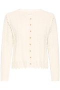 Soft cotton cardigan by Atelier Rêve in a classic birch shade. Easy to layer over dresses and tees for everyday wear. Shop at Dotique.