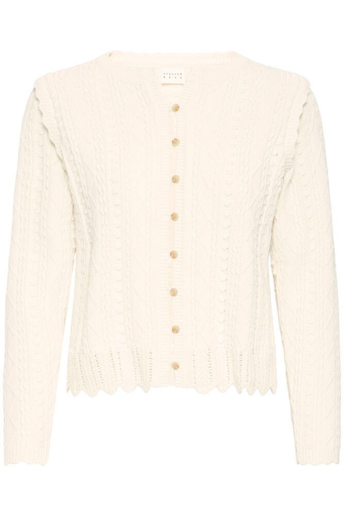 Soft cotton cardigan by Atelier Rêve in a classic birch shade. Easy to layer over dresses and tees for everyday wear. Shop at Dotique.