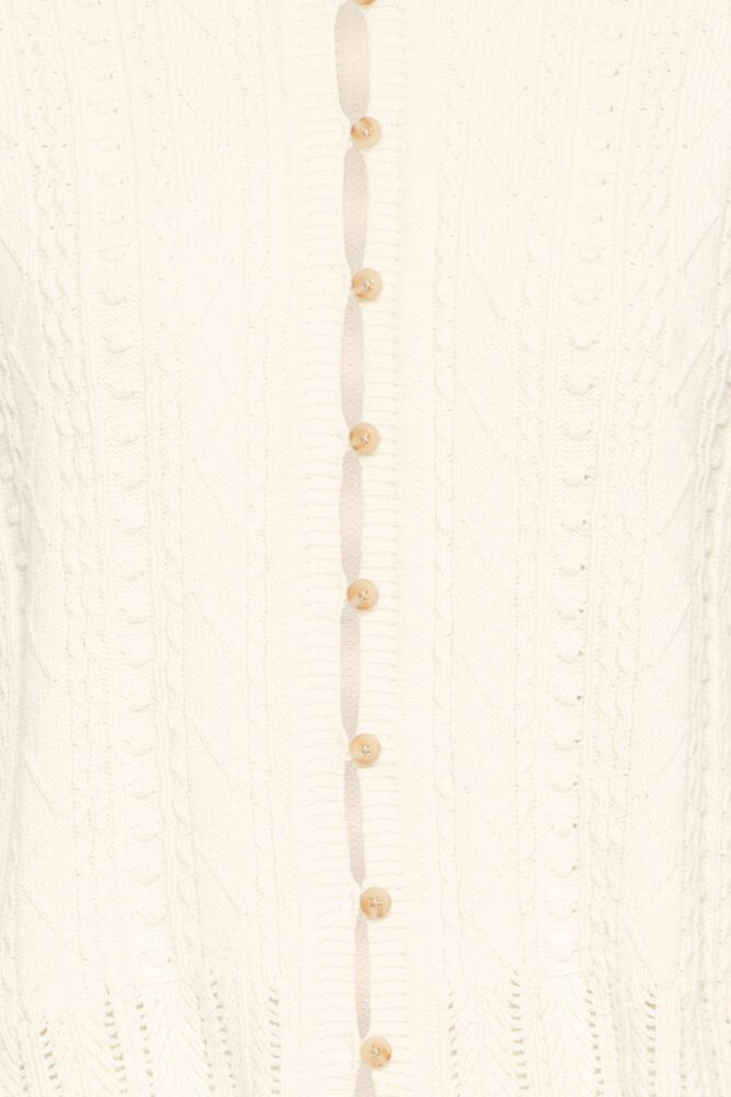 Soft cotton cardigan by Atelier Rêve in a classic birch shade. Easy to layer over dresses and tees for everyday wear. Shop at Dotique.