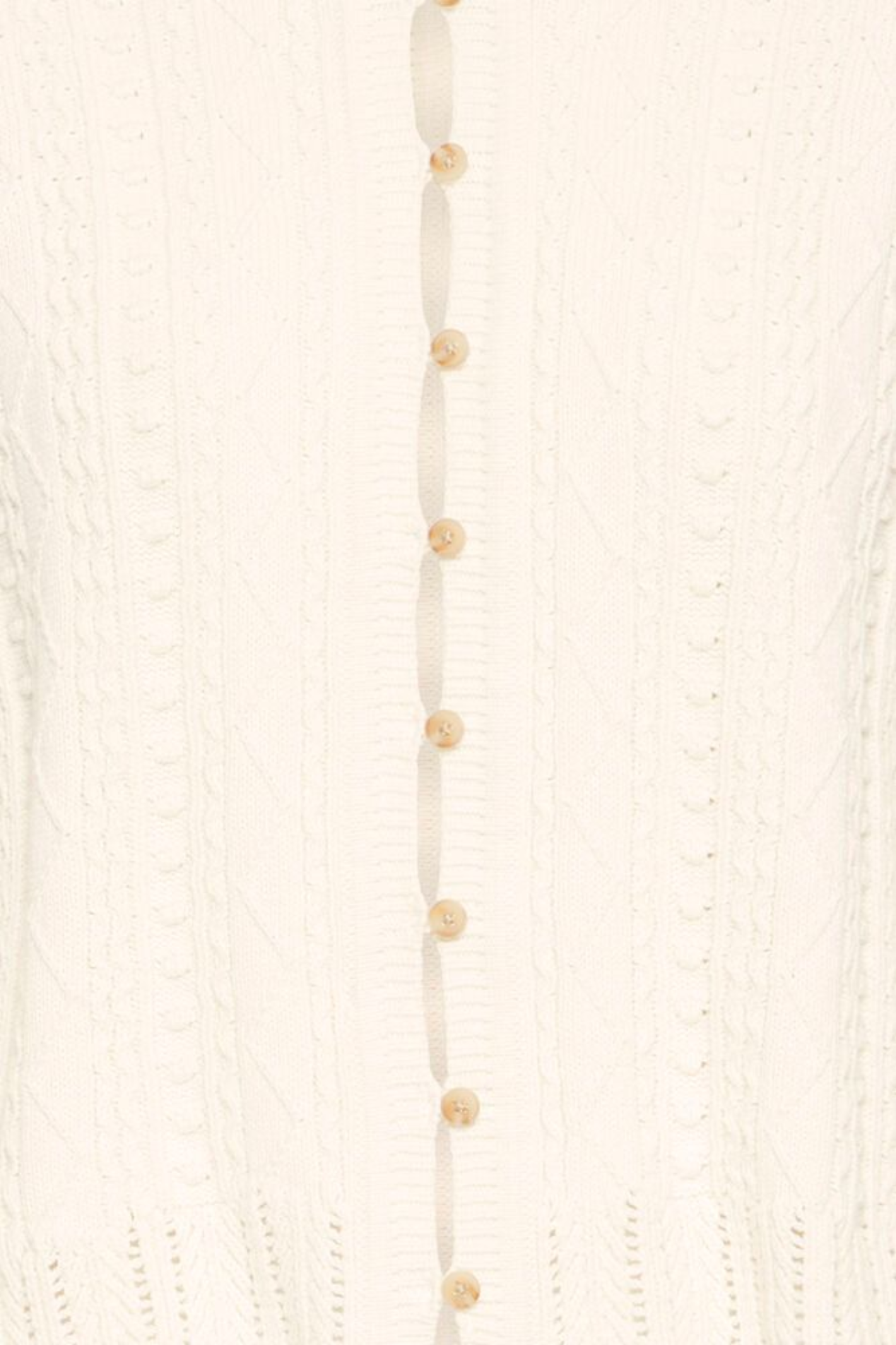 Soft cotton cardigan by Atelier Rêve in a classic birch shade. Easy to layer over dresses and tees for everyday wear. Shop at Dotique.