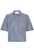 Lightweight cotton linen shirt by Atelier Rêve with a soft blue Odessa print. Easy loose fit with short sleeves. Shop now at Dotique.