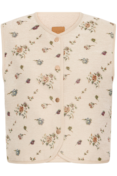 Atelier Rêve Irtambourine jacquard floral waistcoat with a loose, cropped fit. A beautiful layering piece to elevate everyday outfits. Shop at Dotique.
