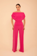 Model wearing ATOM LABEL Carbon Jumpsuit in Hot Pink by ATOM LABEL, shop ATOM LABEL at Dotique for stylish fashion.