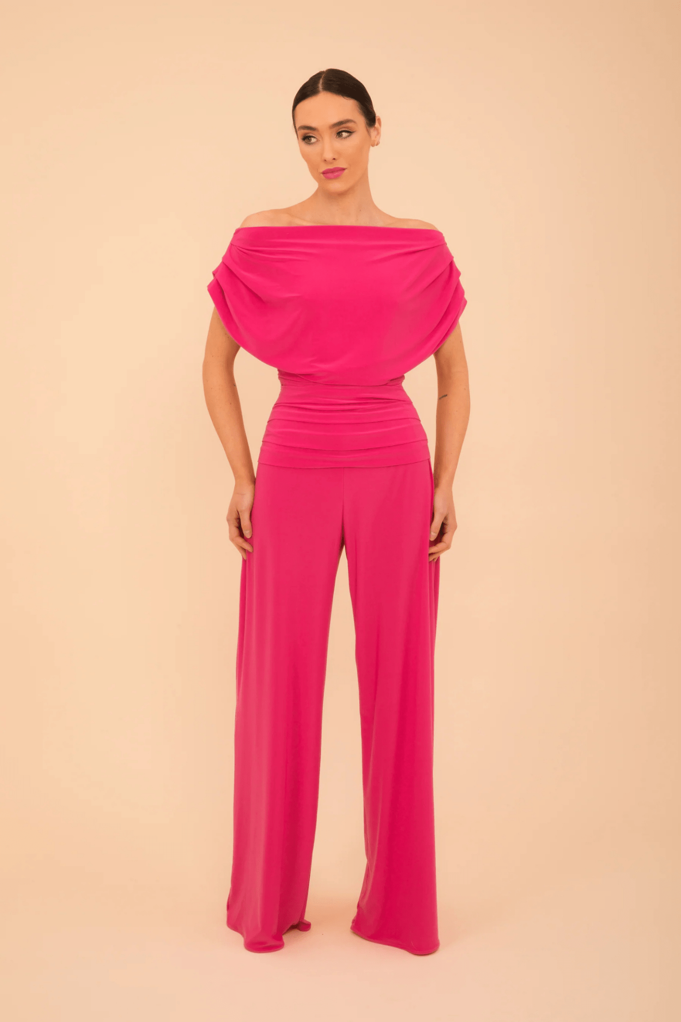 Model wearing ATOM LABEL Carbon Jumpsuit in Hot Pink by ATOM LABEL, shop ATOM LABEL at Dotique for stylish fashion.