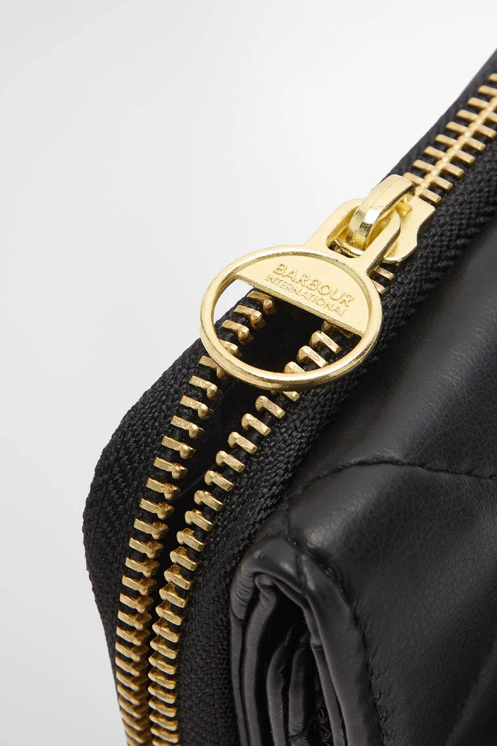 Barbour International Aurora Purse Black LAC0365 black leather purse with gold zip. Shop Barbour International at Dotique.