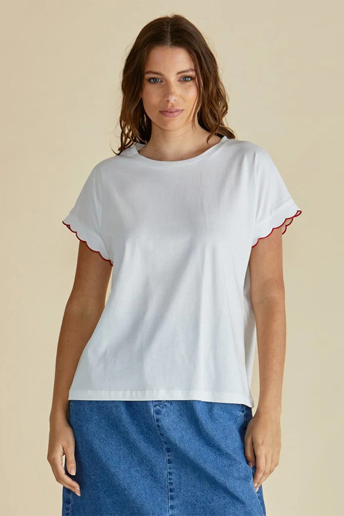 Model wearing Betty Basics Sloane White and Red Scallop T-Shirt, front view