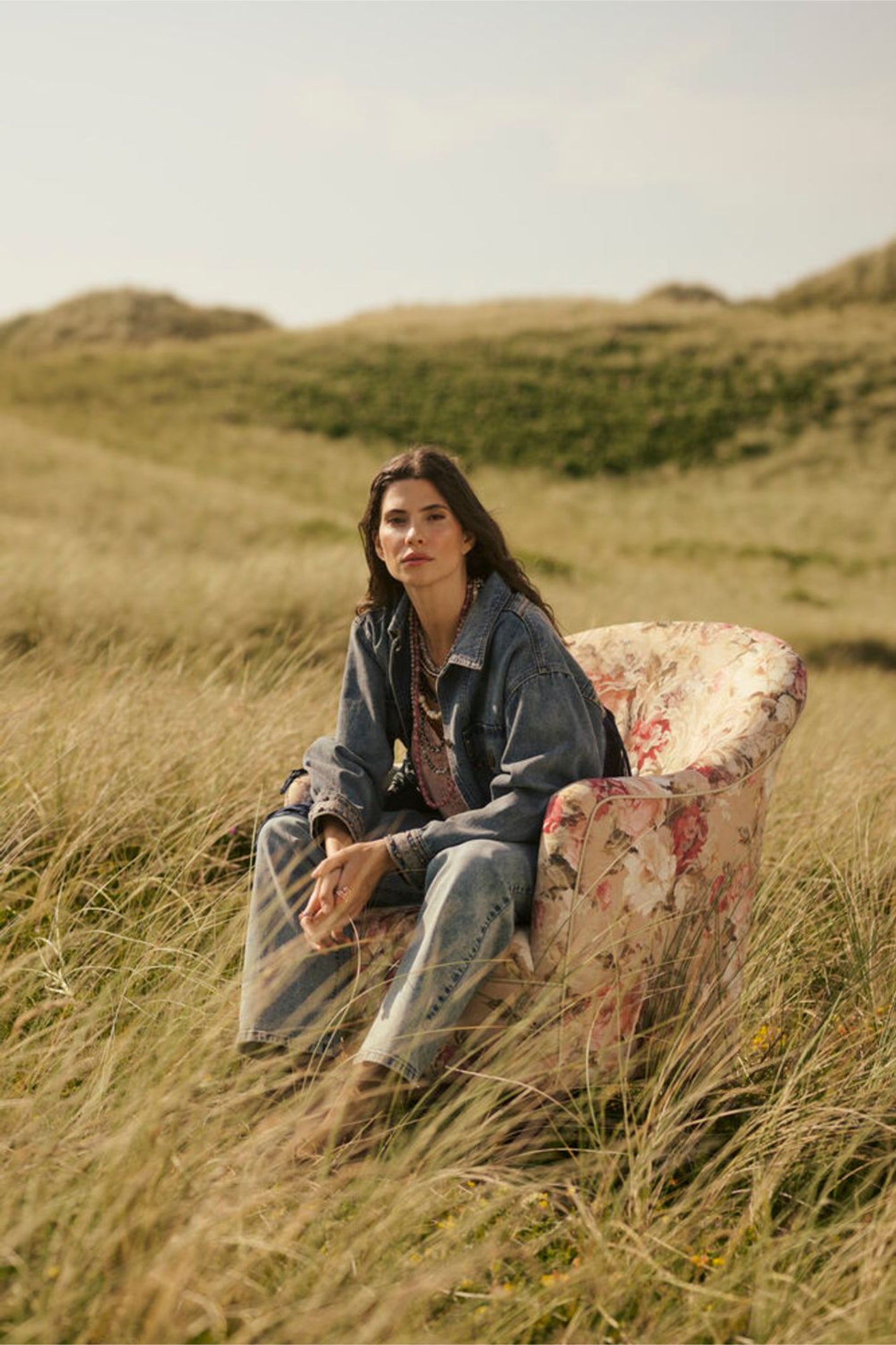 Model seated outdoors wearing Cream 10611224 CRanna Peach Blush Lace Vest Top by Cream shop the vendor at Dotique