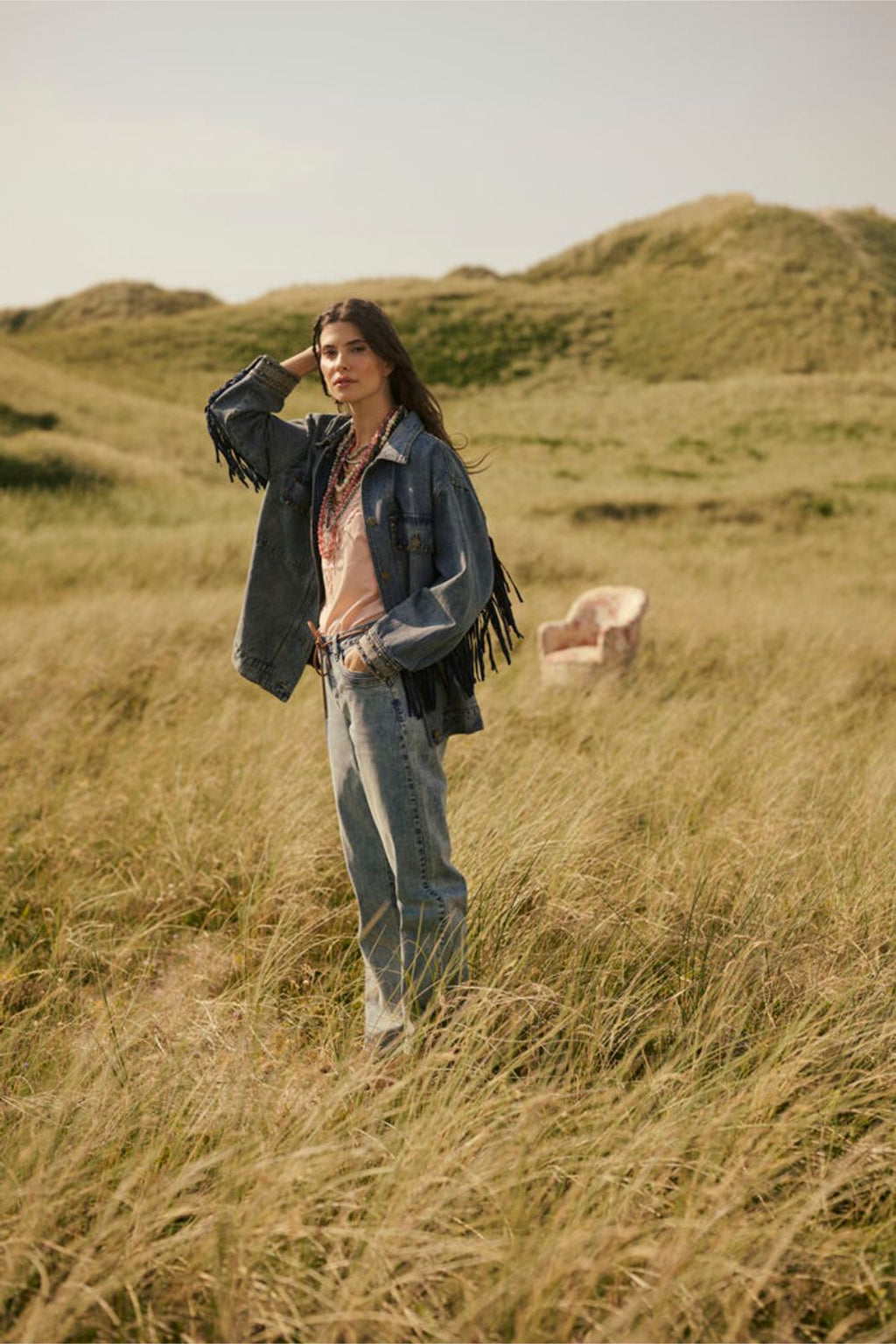 Model standing in tall grass wearing Cream 10611224 CRanna Peach Blush Lace Vest Top by Cream shop the vendor at Dotique