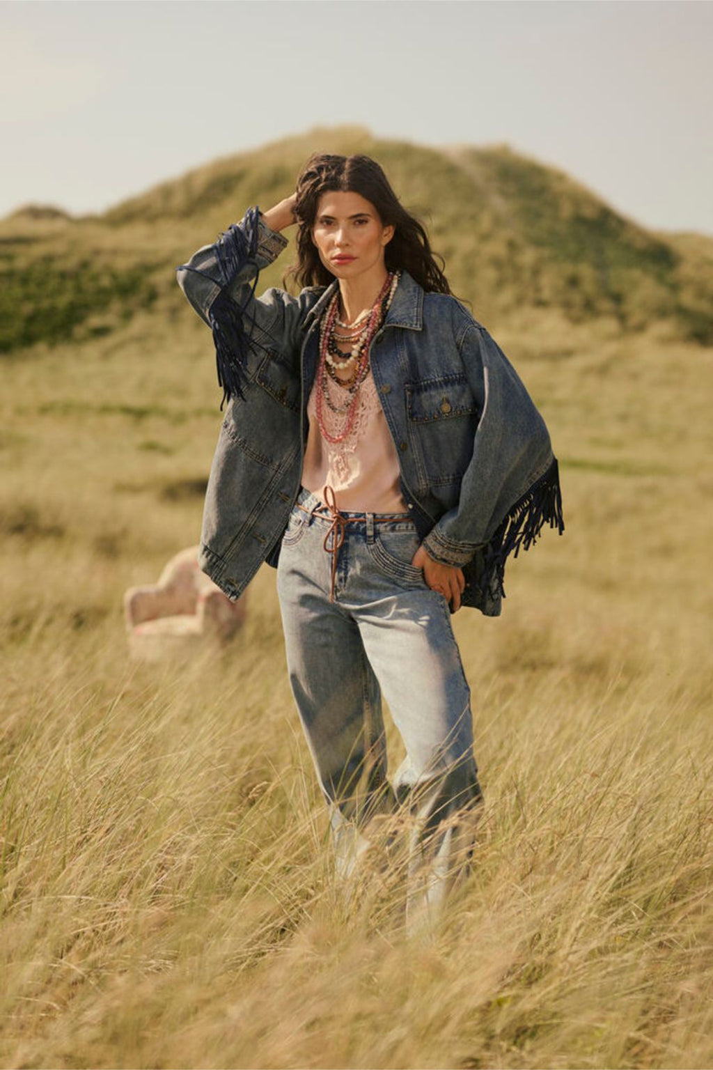 Model posing outdoors wearing Cream 10611224 CRanna Peach Blush Lace Vest Top by Cream, shop the vendor at Dotique