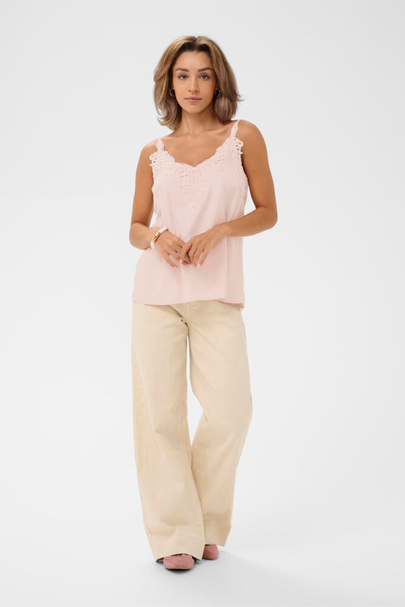 Model wearing Cream 10611224 CRanna Peach Blush Lace Vest Top by Cream, shop the vendor at Dotique full body front view