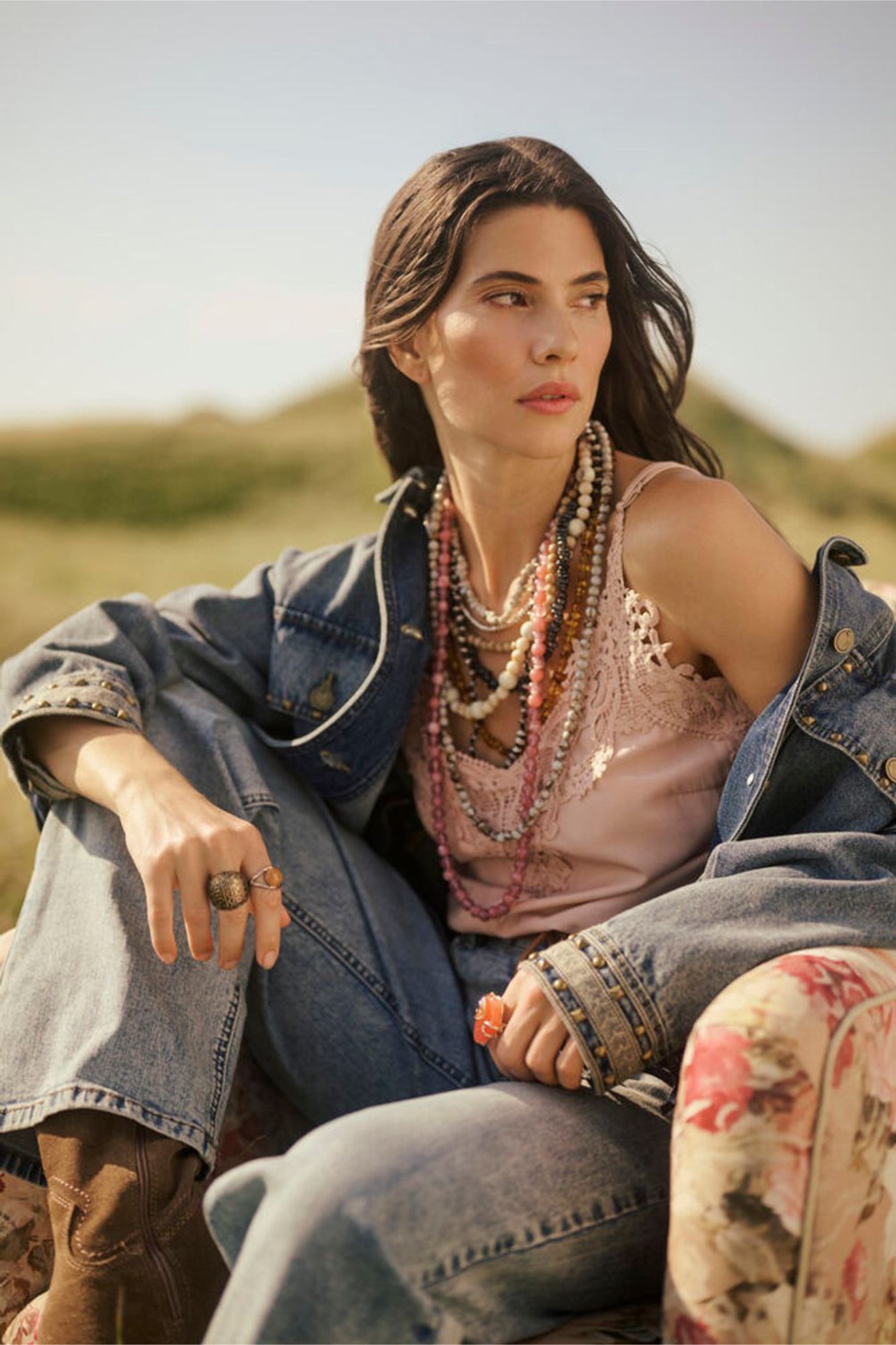 Model seated wearing Cream 10611224 CRanna Peach Blush Lace Vest Top paired with denim jacket by Cream Shop the Vendor at Dotique