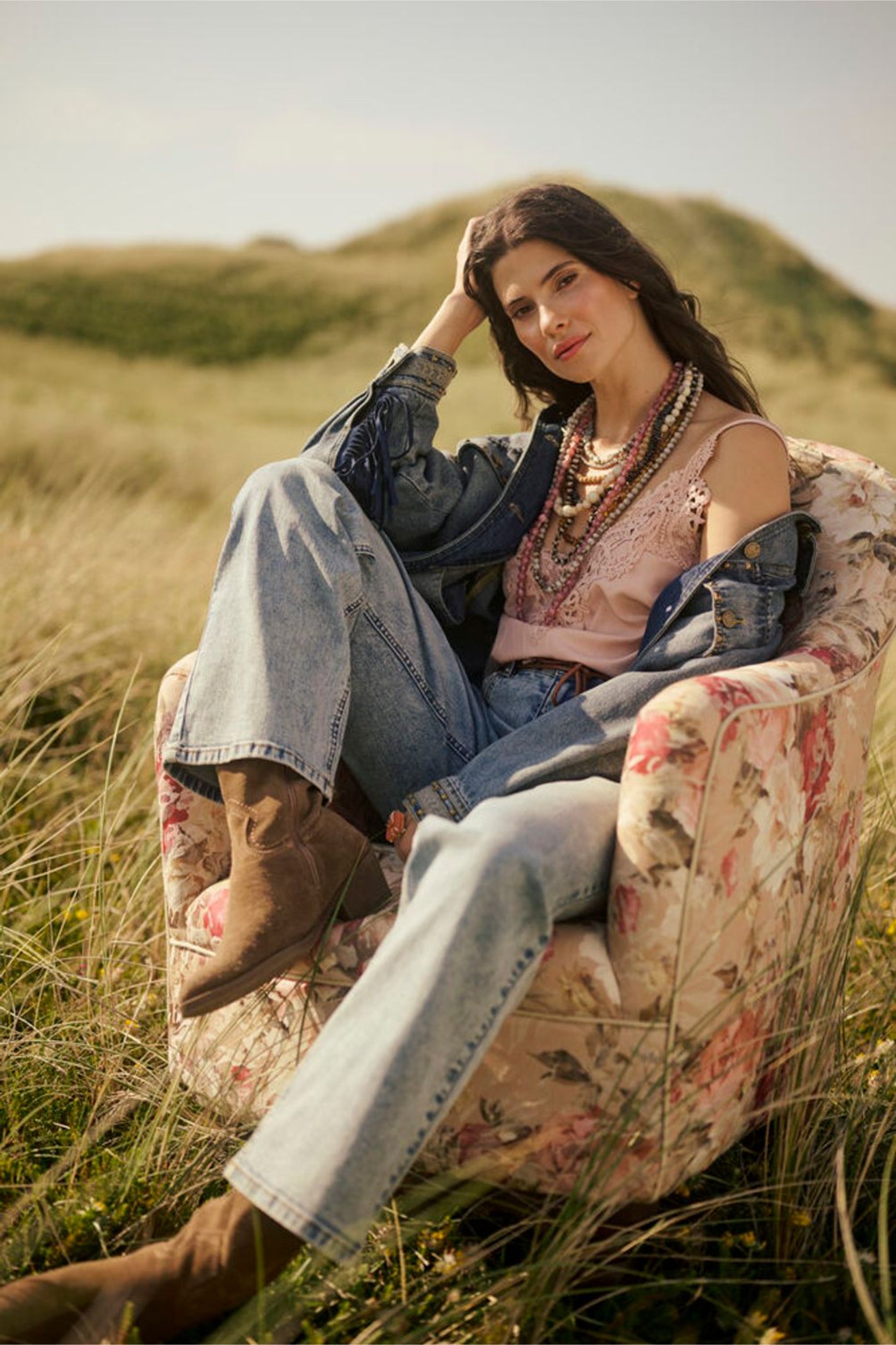 Model seated outdoors wearing Cream 10611224 CRanna Peach Blush Lace Vest Top by Cream shop the vendor at Dotique
