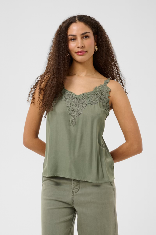 Shop the Cream CRAnna Top in Java at Dotique. A lace-trim V-neck cami with adjustable straps and a flattering fit, perfect for layering or wearing alone.