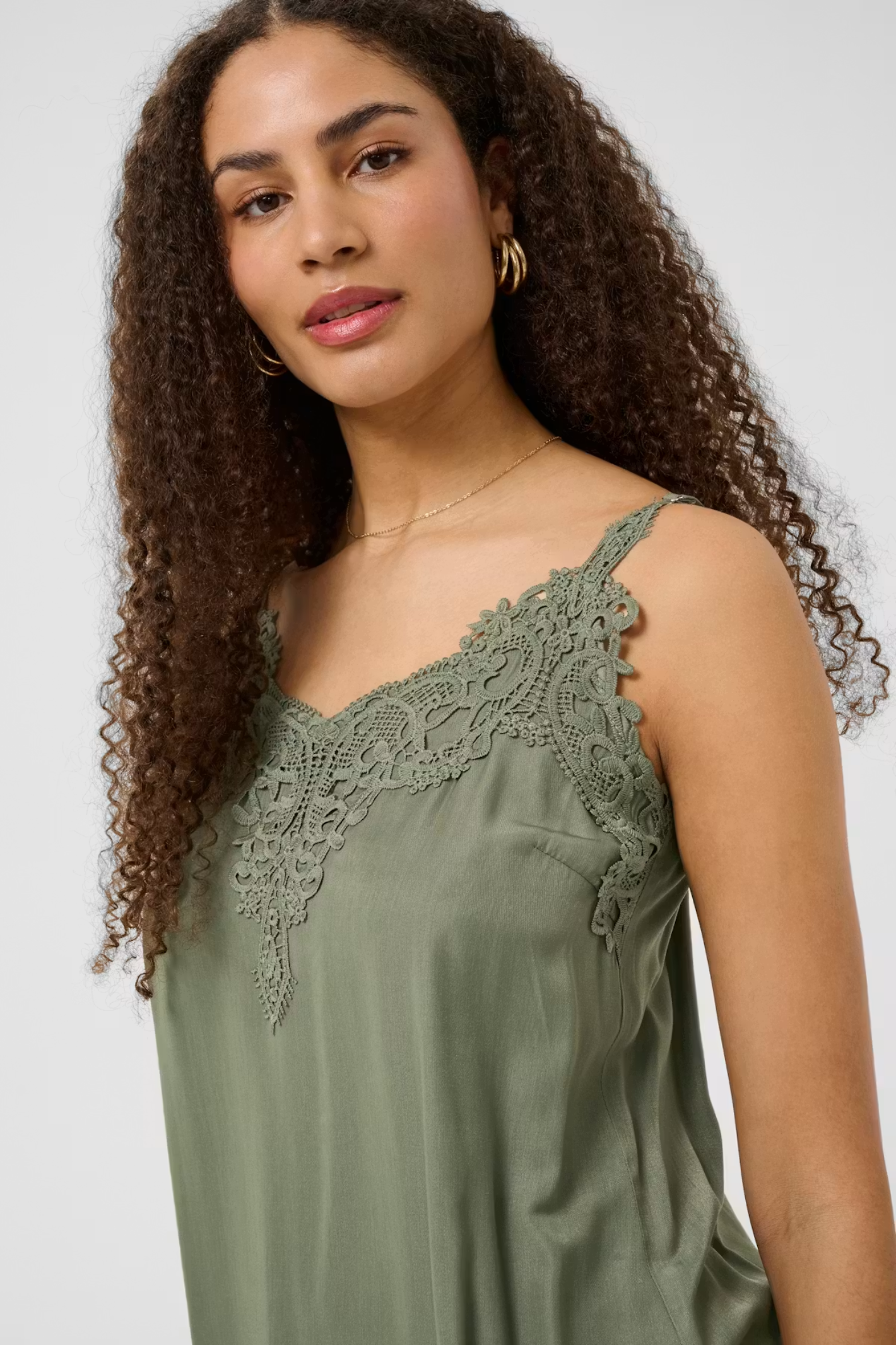 Shop the Cream CRAnna Top in Java at Dotique. A lace-trim V-neck cami with adjustable straps and a flattering fit, perfect for layering or wearing alone.