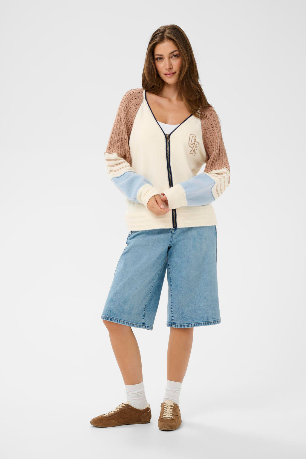 Model wearing Cream CRPura Knit Jacket Whisper White 10614765 by Cream with knit panel sleeves, shop the vendor at Dotique