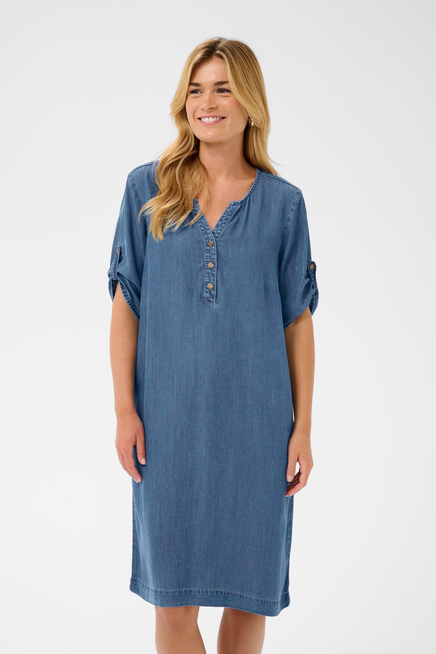 Smiling model wearing Cream 10614841 CRMolly Dress Jaspar Blue Denim by Cream, shop the vendor at Dotique