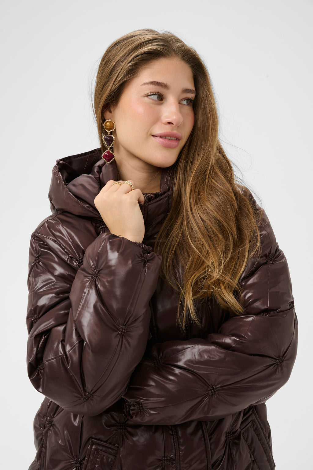 Cream CRDrakie midi quilted jacket in Coffee Bean with a gathered quilted finish, hood, high collar and concealed front fastening.