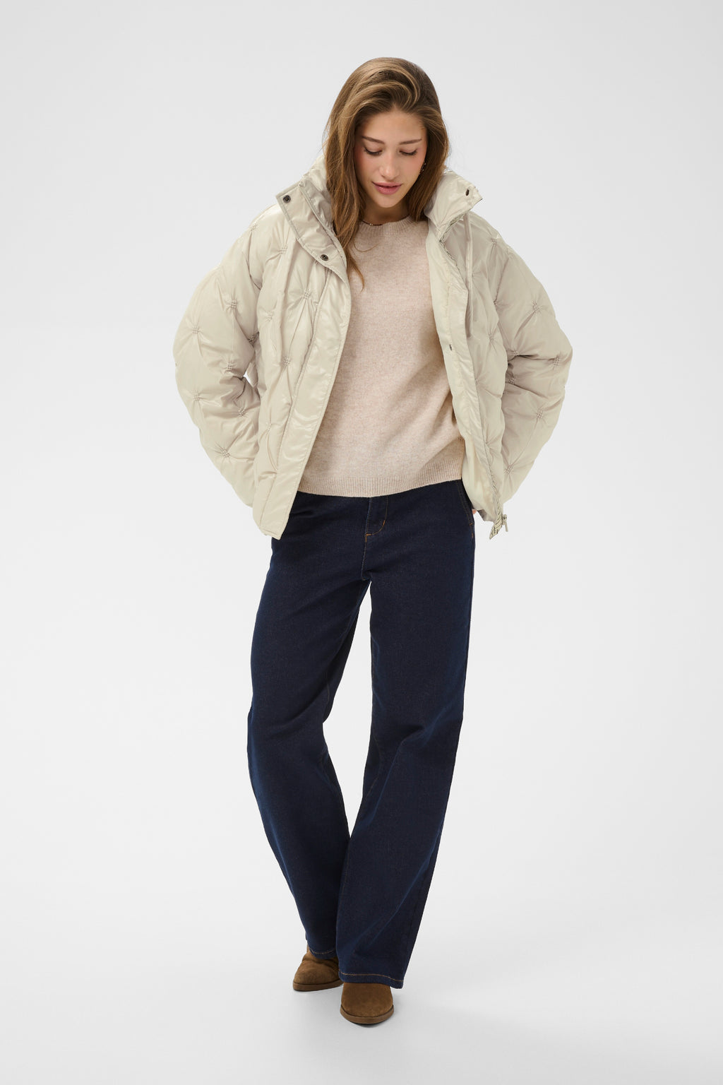 Cream CRDrakie quilted short jacket in Oatmeal featuring a gathered quilted design, hood, high collar and zip fastening.