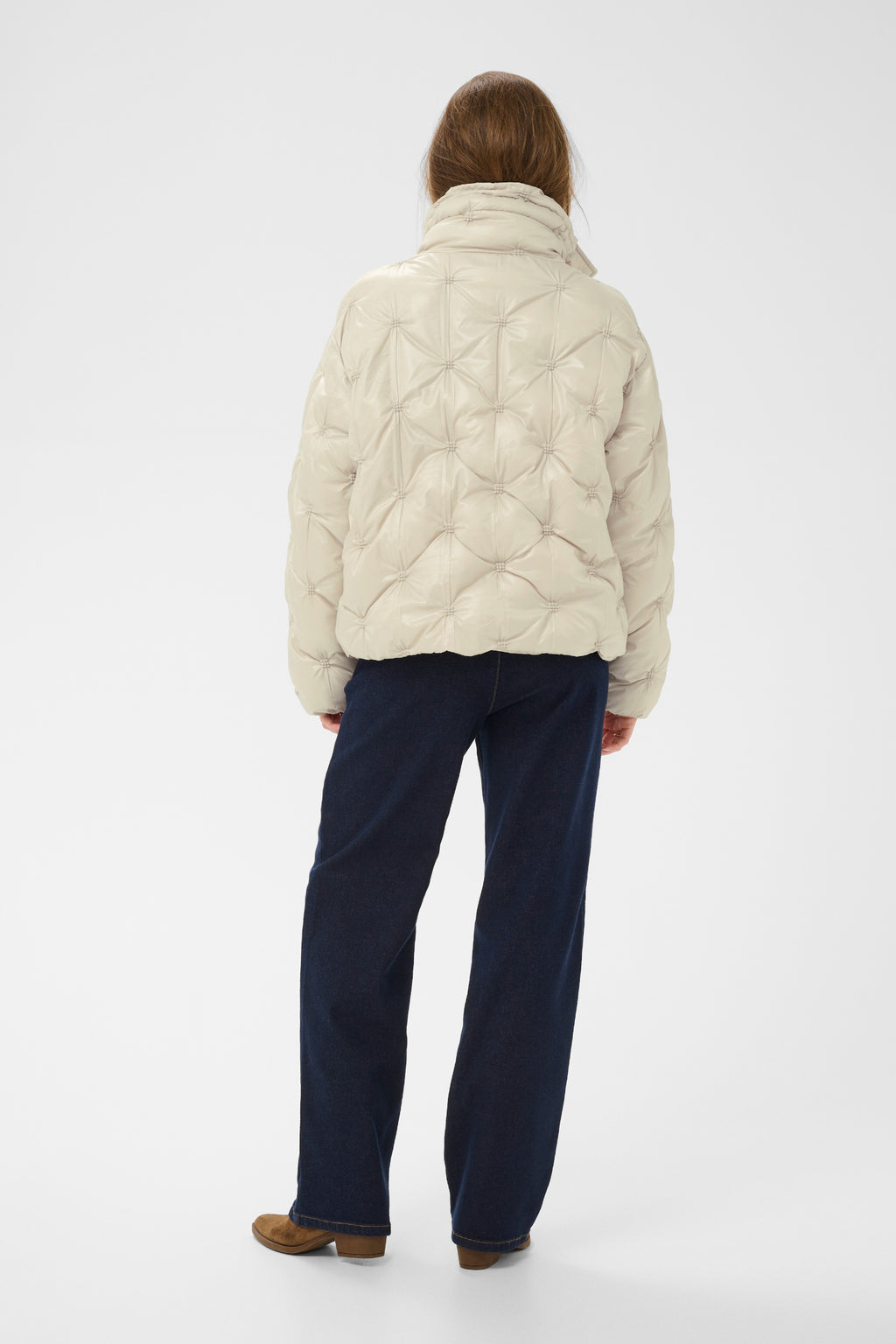 Cream CRDrakie quilted short jacket in Oatmeal featuring a gathered quilted design, hood, high collar and zip fastening.