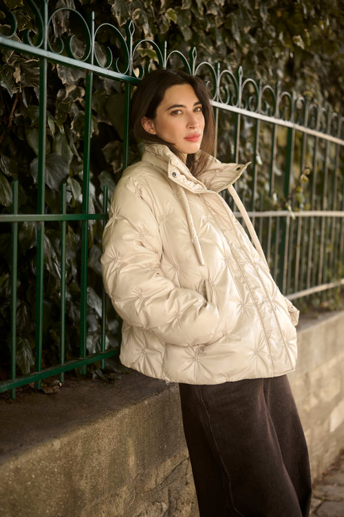 Cream CRDrakie quilted short jacket in Oatmeal featuring a gathered quilted design, hood, high collar and zip fastening.