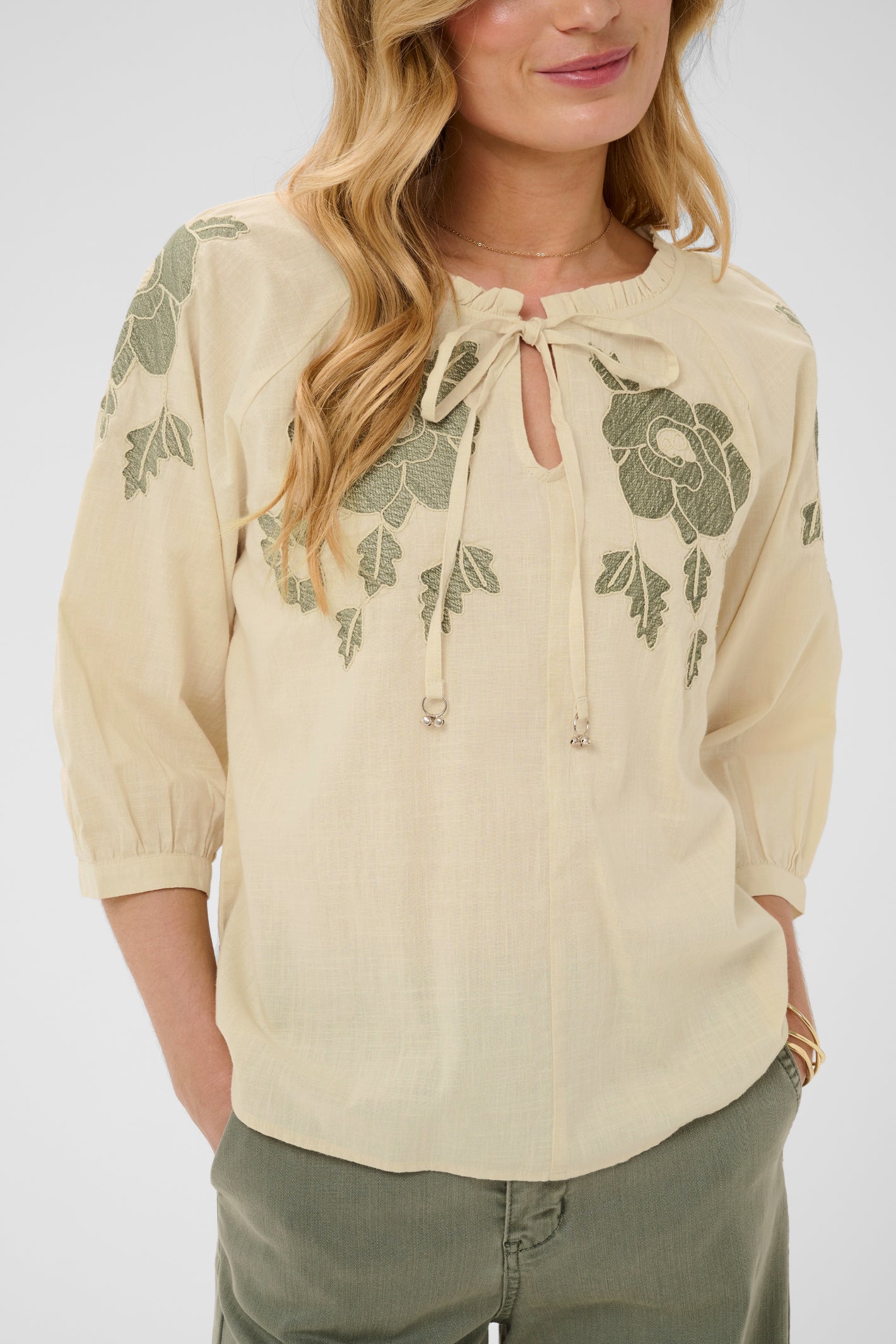 Cream CRZosa embroidered cotton blouse in Bleached Sand with floral embroidery, tie neckline and three-quarter sleeves.