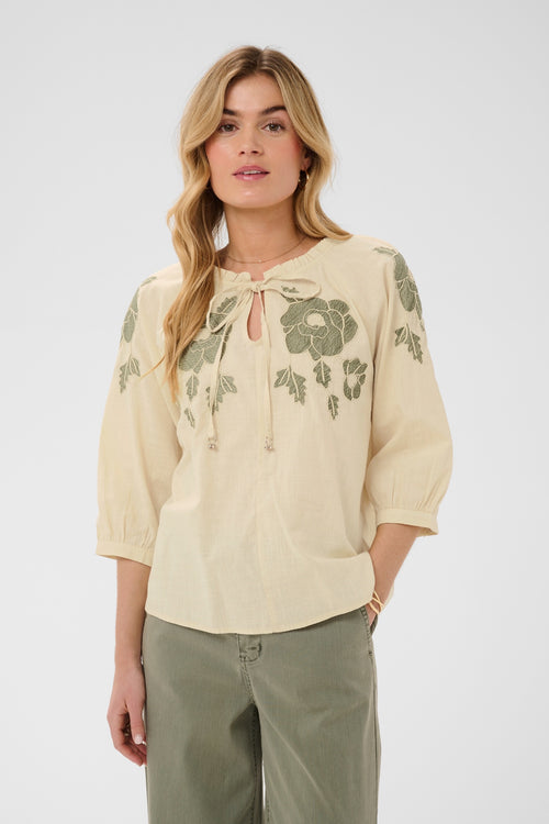 Cream CRZosa embroidered cotton blouse in Bleached Sand with floral embroidery, tie neckline and three-quarter sleeves.