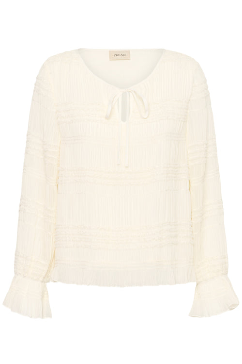 Cream CRSissel textured blouse in Whisper White with tie neckline, layered frill detailing and long ruffle sleeves.