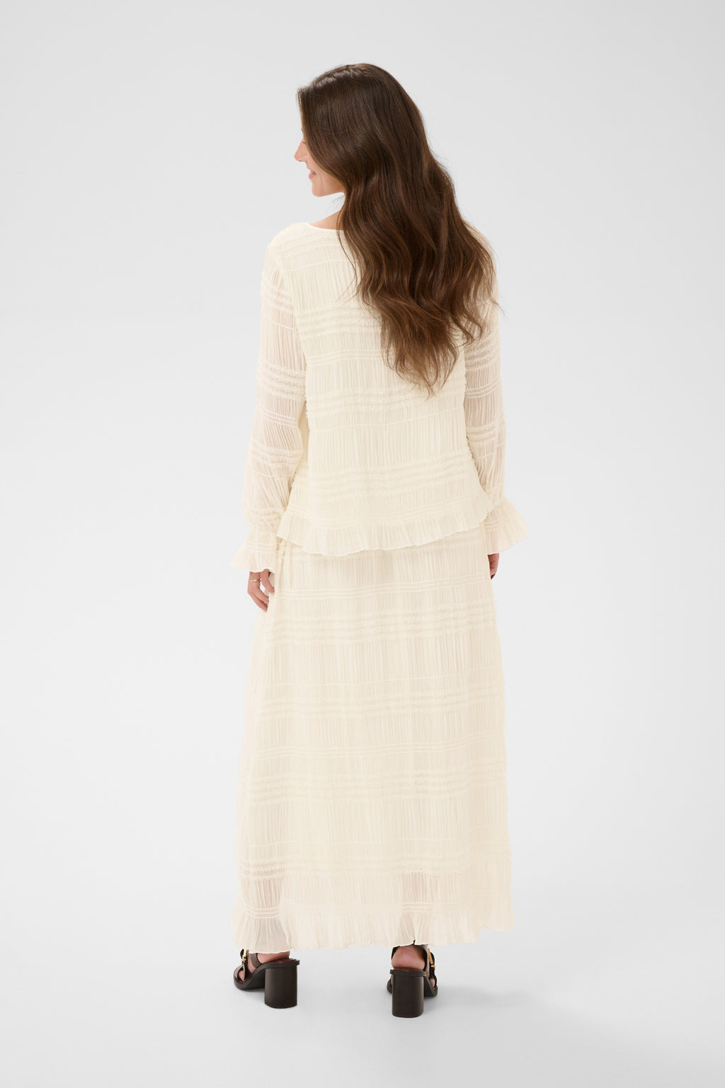 Cream CRSissel textured blouse in Whisper White with tie neckline, layered frill detailing and long ruffle sleeves.