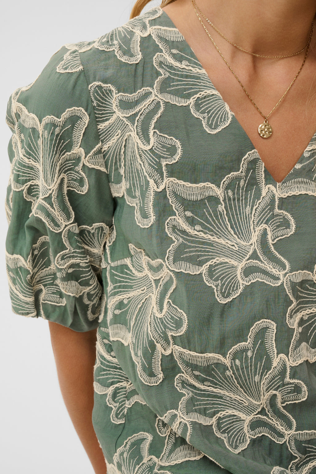Cream CRTorli short dress in Mulled Basil green featuring a textured floral design, V-neckline and elbow-length sleeves.